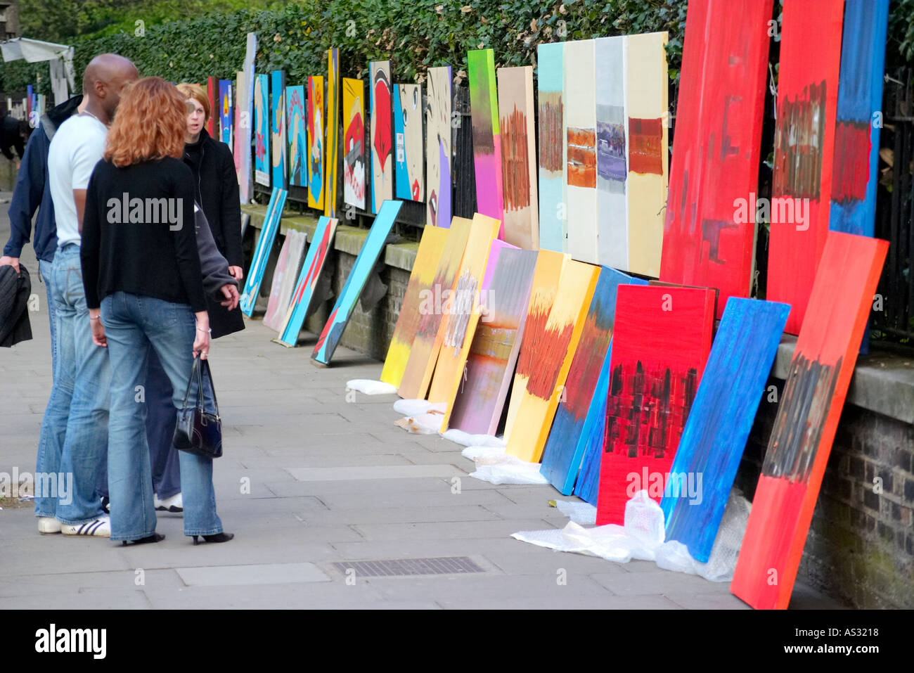 Art artists paintings pictures on Bayswater Exhibition Road Rd in London England Britain UK united kingdom Stock Photo