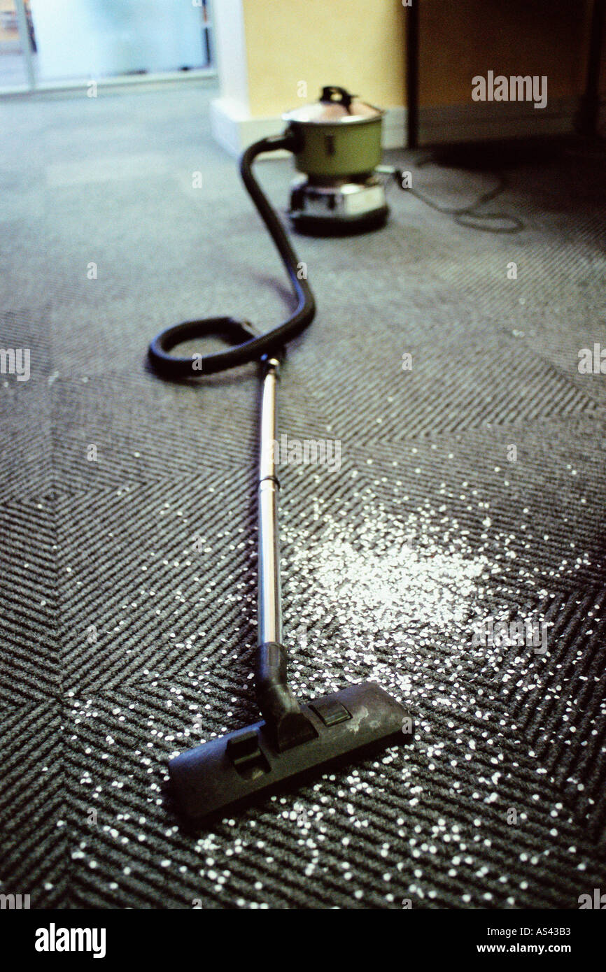 Hoover and messy carpet Stock Photo Alamy
