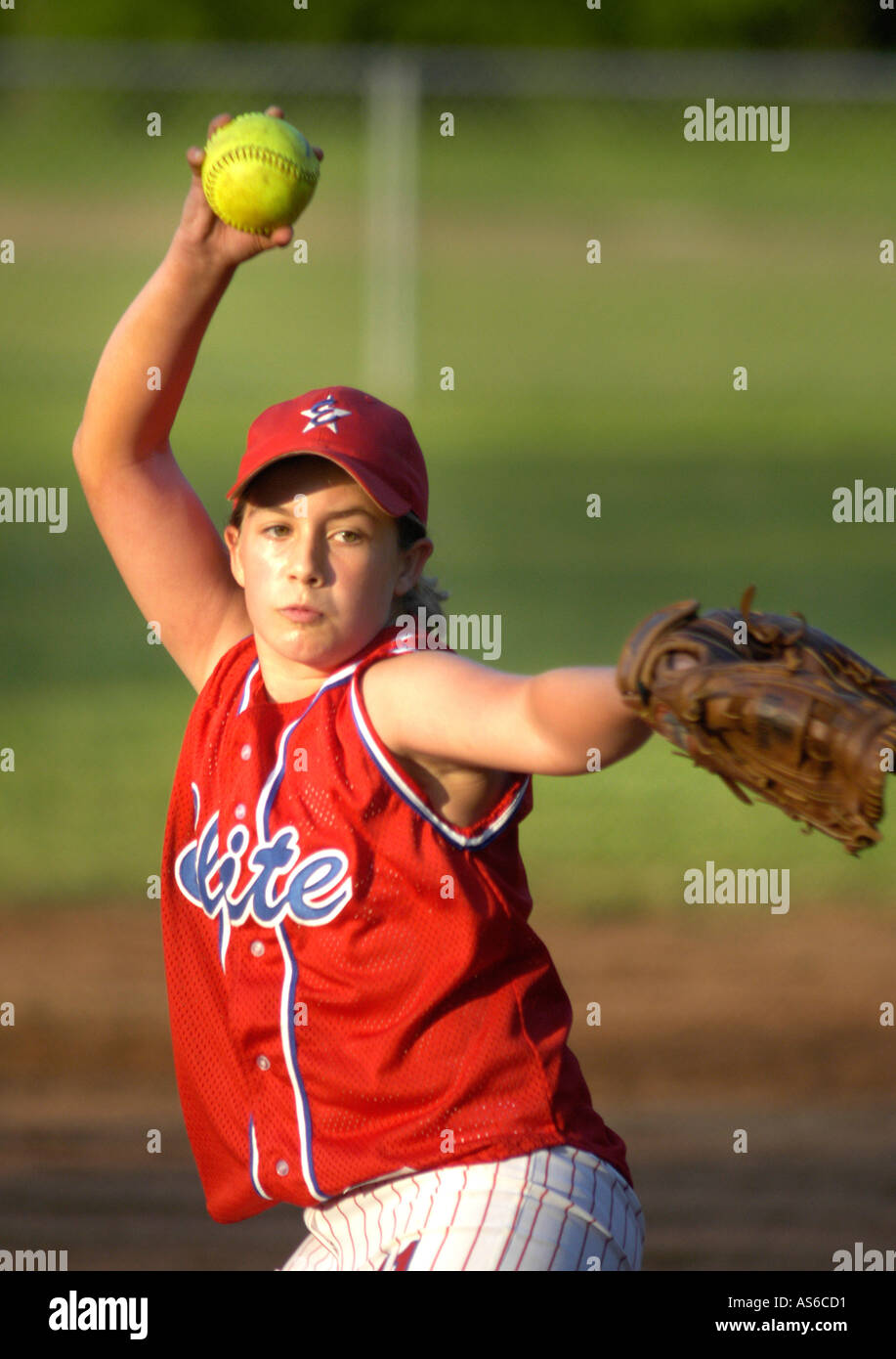 Young girl pitching and learning in real Fast Pitch Softball practice