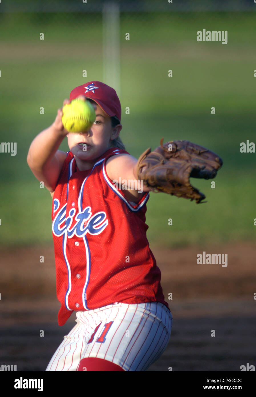 Young girl pitching and learning in real Fast Pitch Softball practice