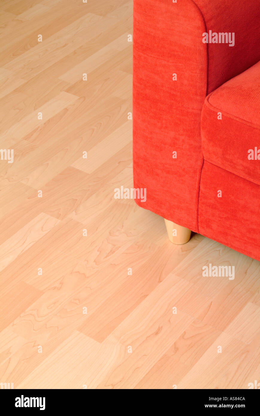 red sofa on a wooden floor Stock Photo