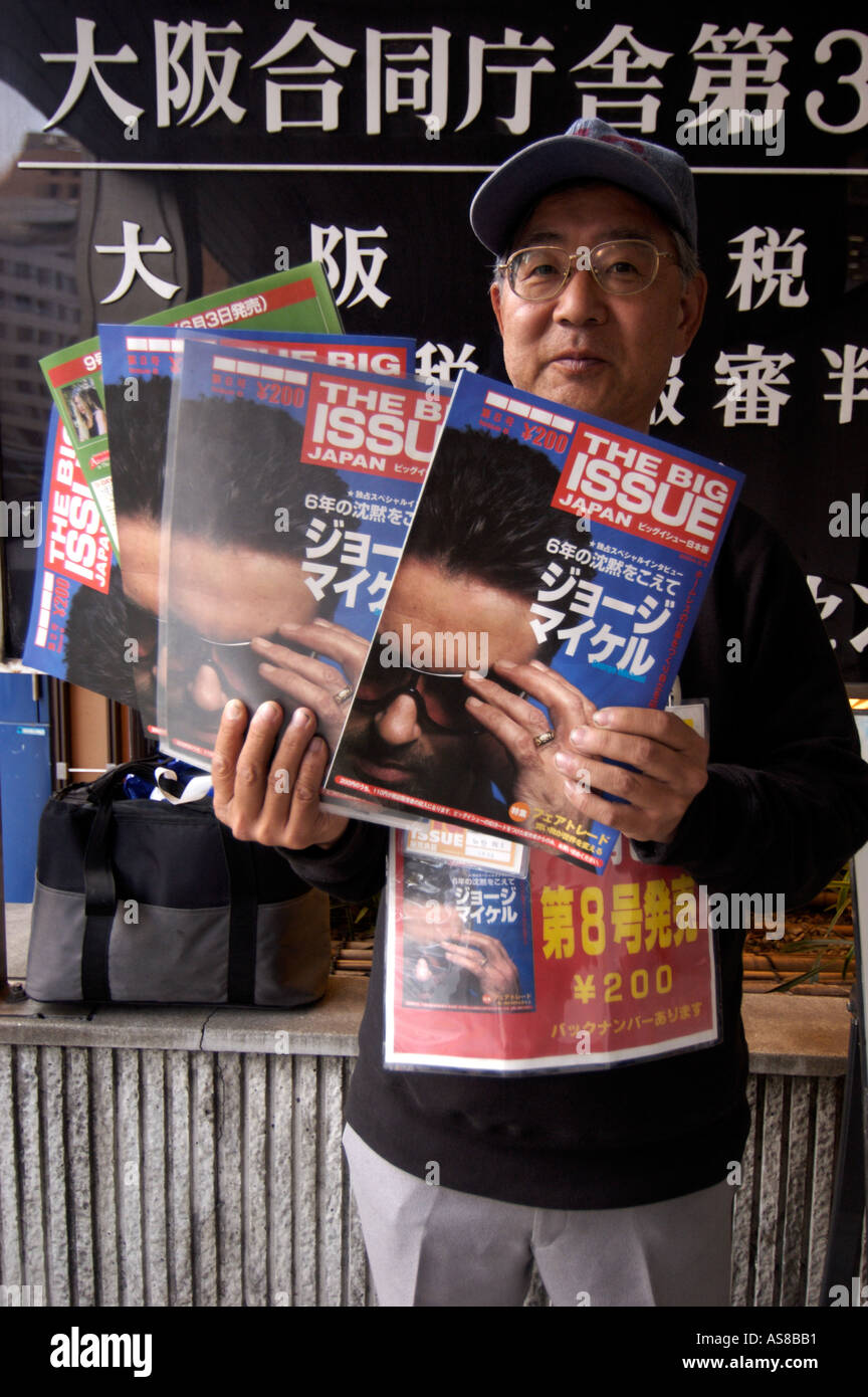 A homeless man sells the Japanese edition of The Big Issue in Osaka Japan Stock Photo