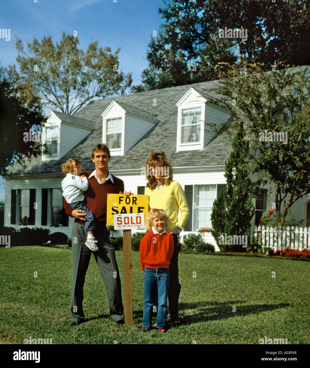 family of four buying home Stock Photo