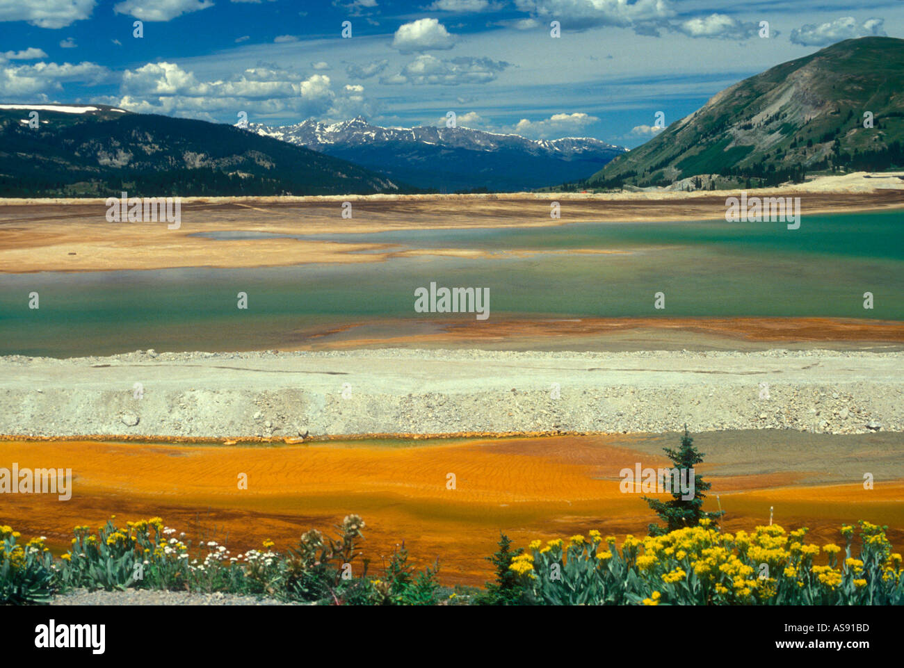 Climax Colorado The tailings ponds at the Climax Molybdenum mine with snow capped Rocky Mountains in the background Stock Photo