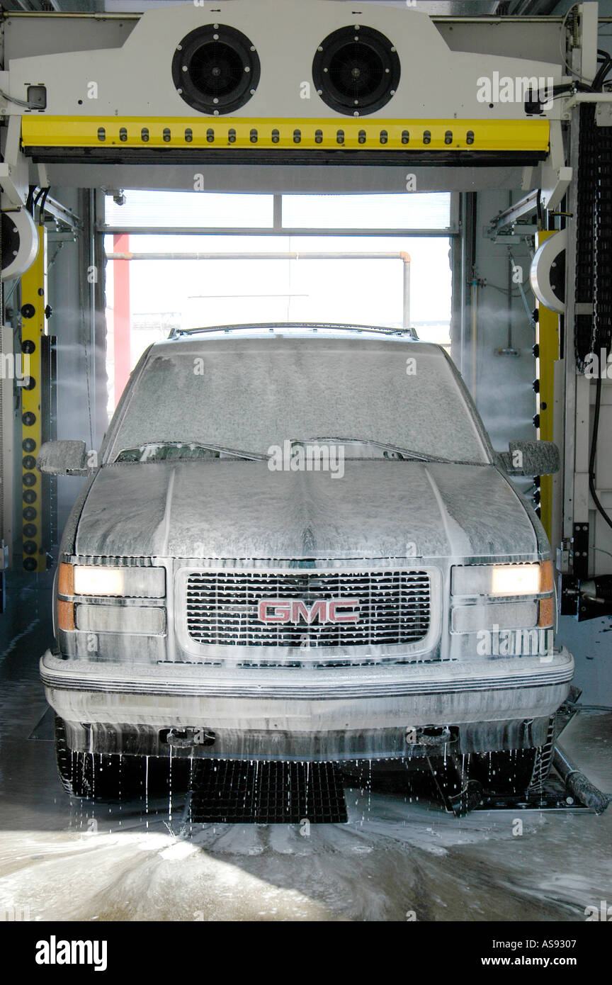 Automobile is Cleaned and Detailed while going through a car wash Stock
