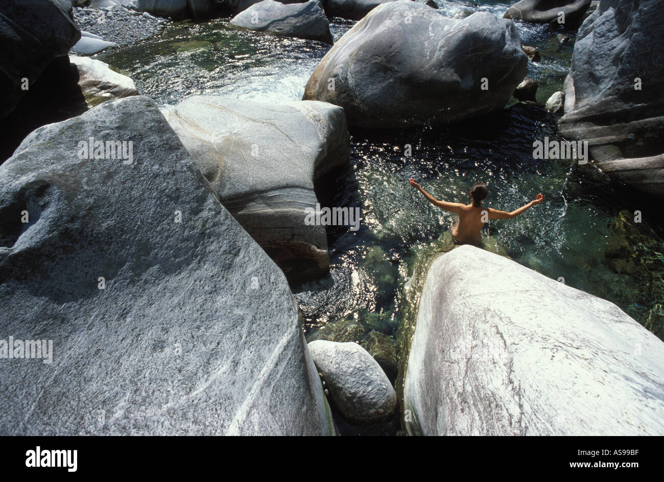 Naked Woman At The Valley Of Verzasca Ticino Switzerland Stock Photo naked-woman-at-the-valley-of-verzasca-ticino-switzerland-stock-photo