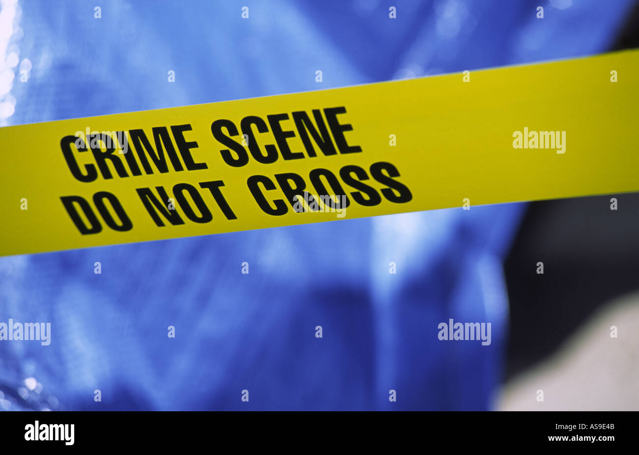 crime scene taped off with yellow police crime scene tape Stock Photo