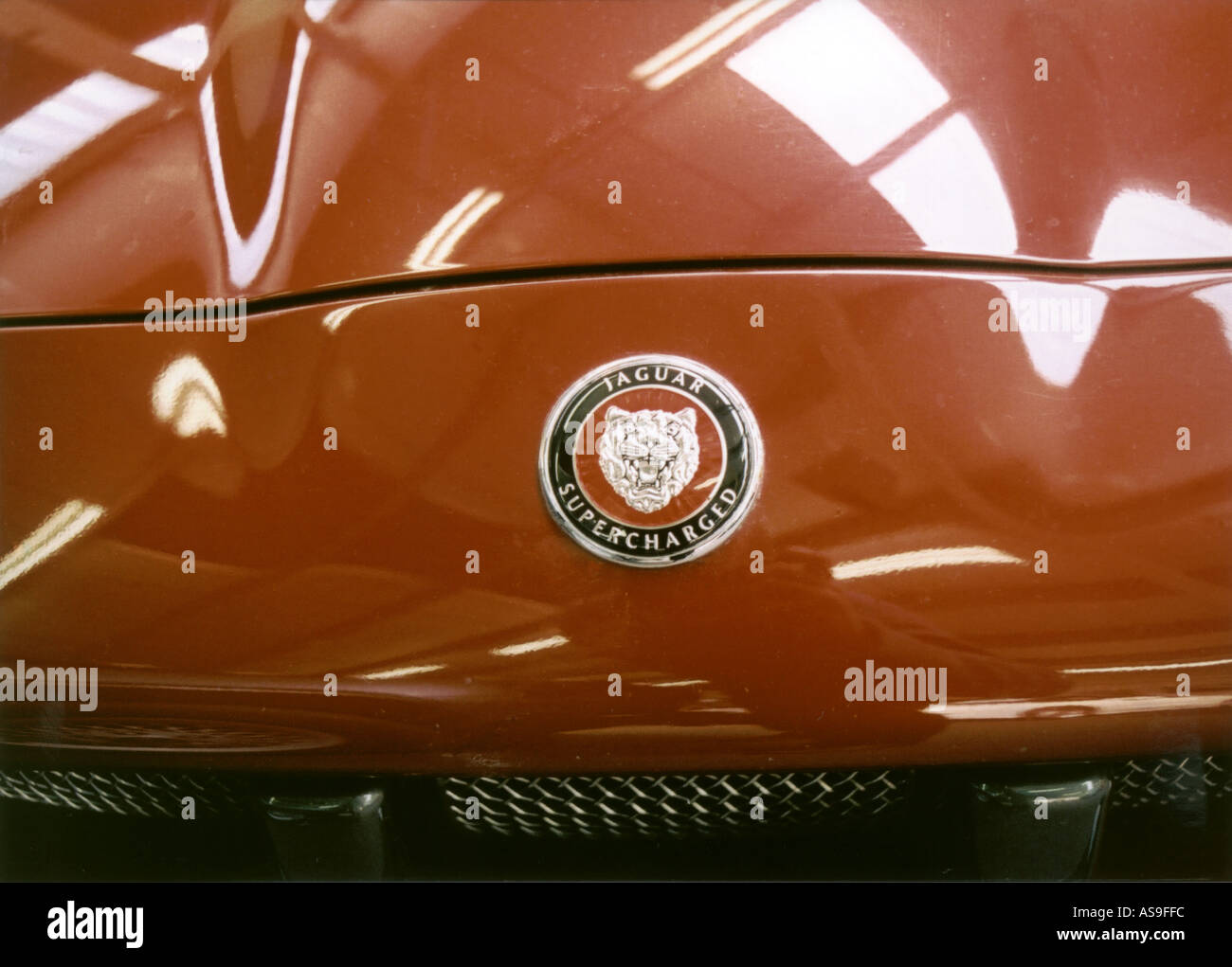 Supercharged Jaguar badge on of car Stock Photo Alamy