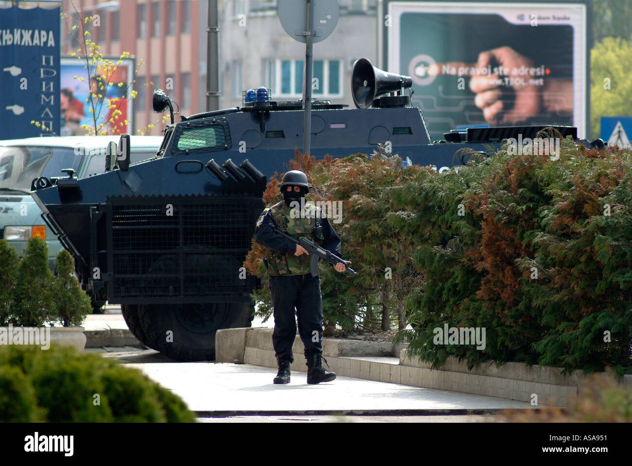 Bosnian Serb Special Forces Soldier and BRDM Armoured Vehicle During a Raid Against Organised Crime Stock Photo
