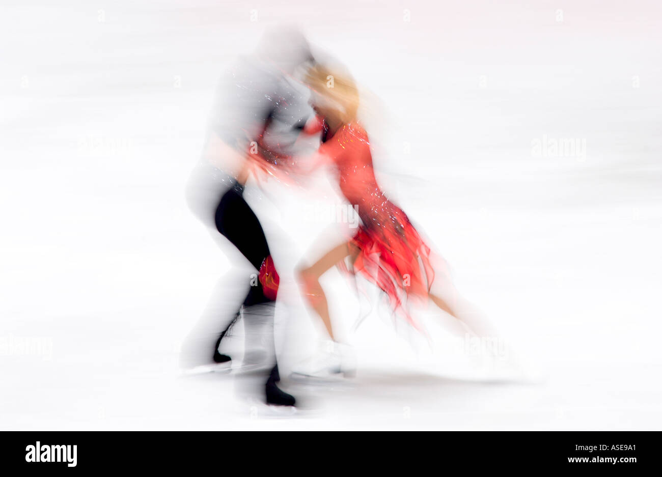 two blurred figure skaters dancing Stock Photo