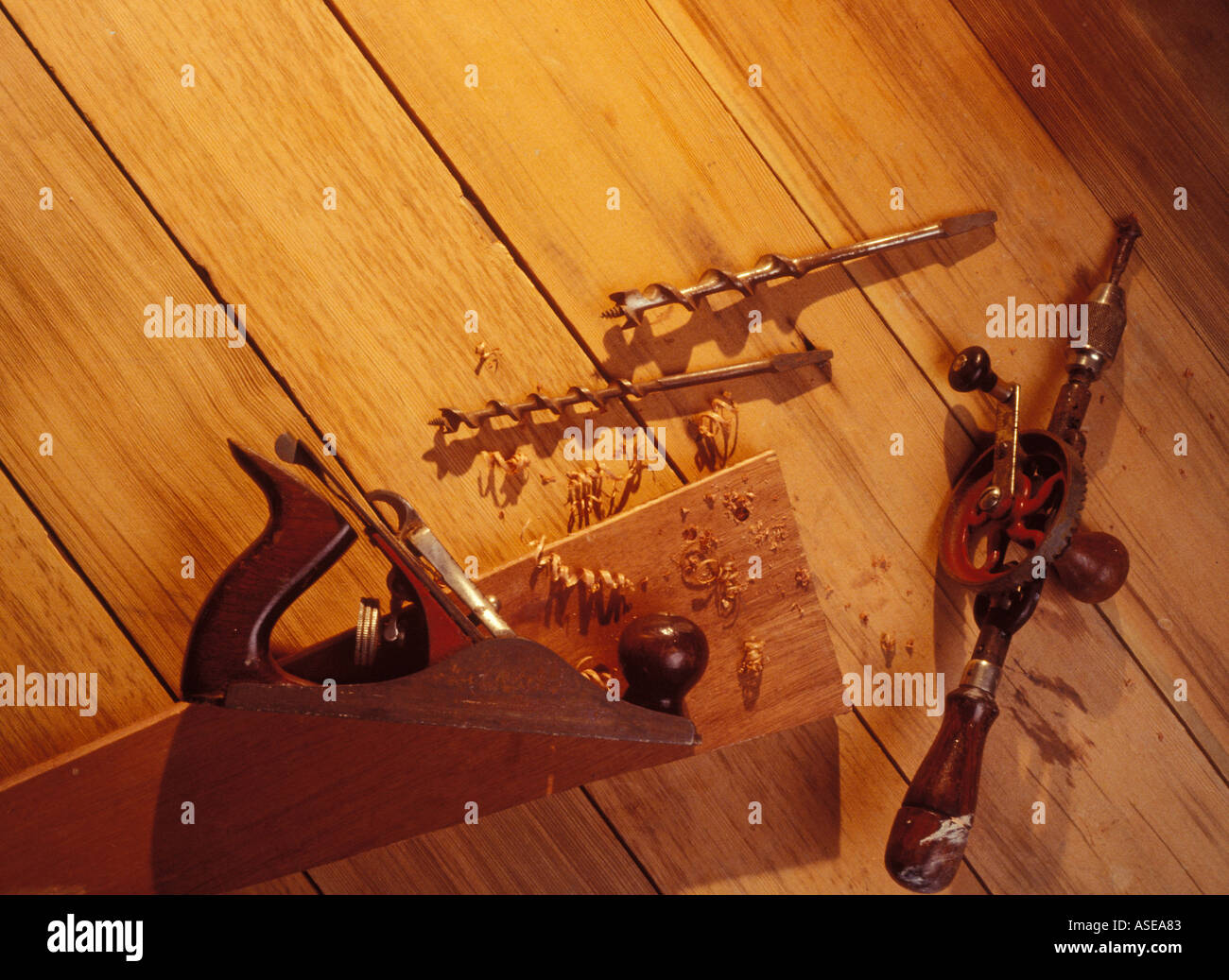 wood working tools on a work bench. Hand drill, bits and jack plane