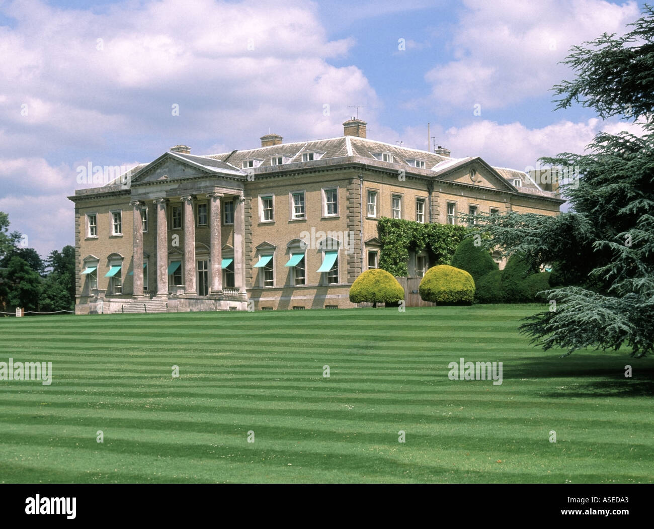 Striped garden lawn & sun blinds Grade I listed Broadlands House Earl and Countess Mountbatten of Burma home near Romsey in Test Valley Hampshire UK Stock Photo