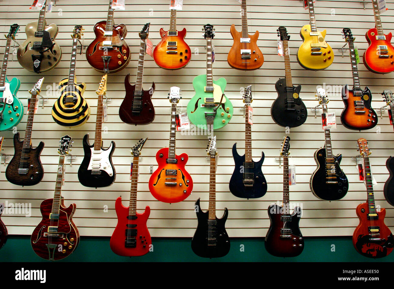Electric Guitars at Music Store Stock Photo - Alamy