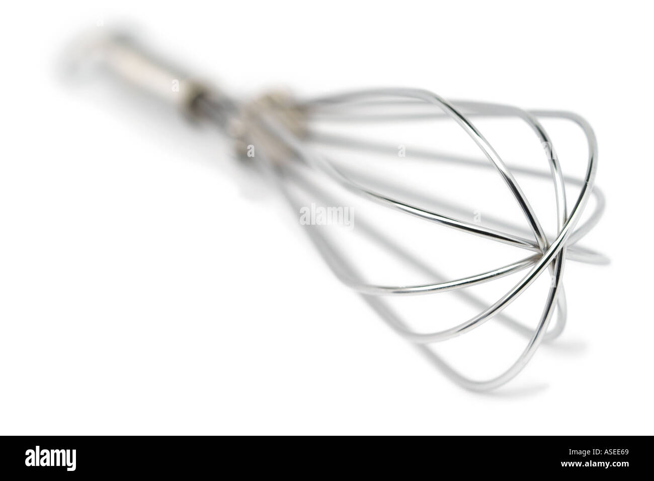 Stainless steel egg whisk Shallow depth of focus  Stock Photo