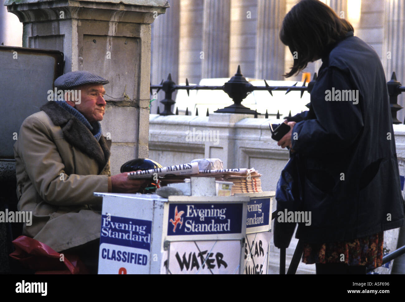 News vendor selling Evening Standard in the City of London, 2004 Stock Photo