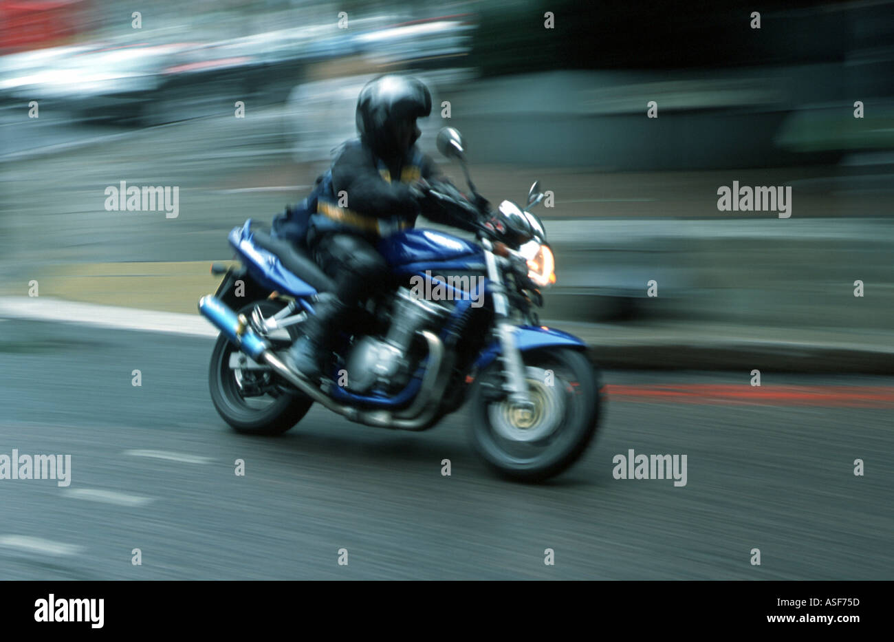 Motor bike messenger in central London Stock Photo