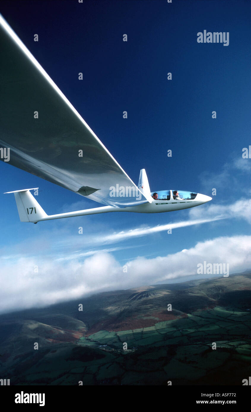Glider flying in blue sky Stock Photo Alamy