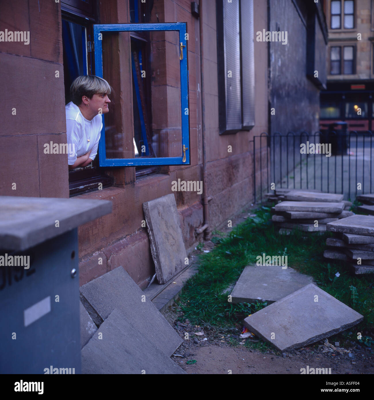 woman at tenement window govan glasgow Stock Photo Alamy