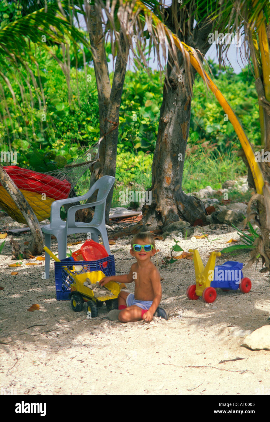 Cool baby playing in the shade wearing shades Stock Photo Alamy
