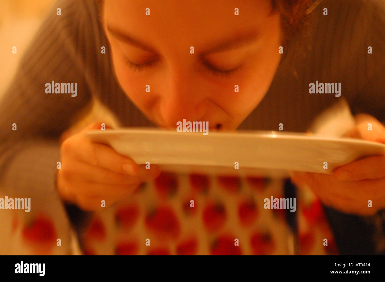 Woman licking plate hires stock photography and images Alamy