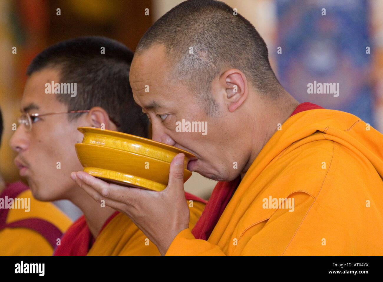 Tibetan buddhist monk drinking butter tea Stock Photo Alamy