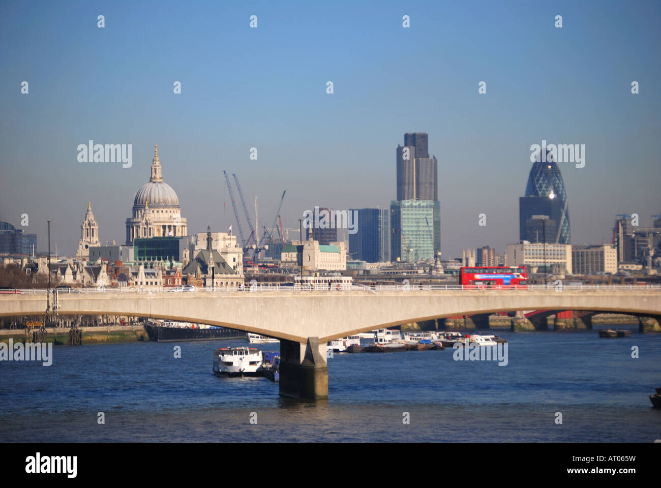 View across River Thames and Waterloo Bridge to City of London Stock Photo