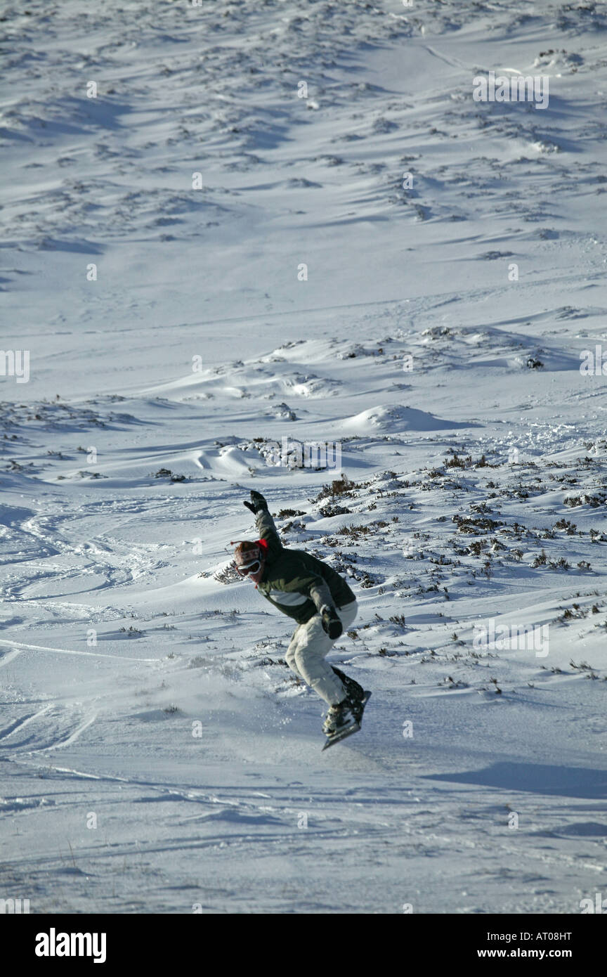 Snowboarder jumping, Cairngorms National Park, Glenshee ski slopes, Aberdeenshire and Perthshire, Scotland, UK, Europe Stock Photo
