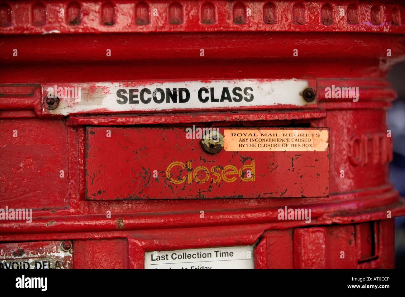 Red postbox pillar with second class mail slot closed Stock Photo