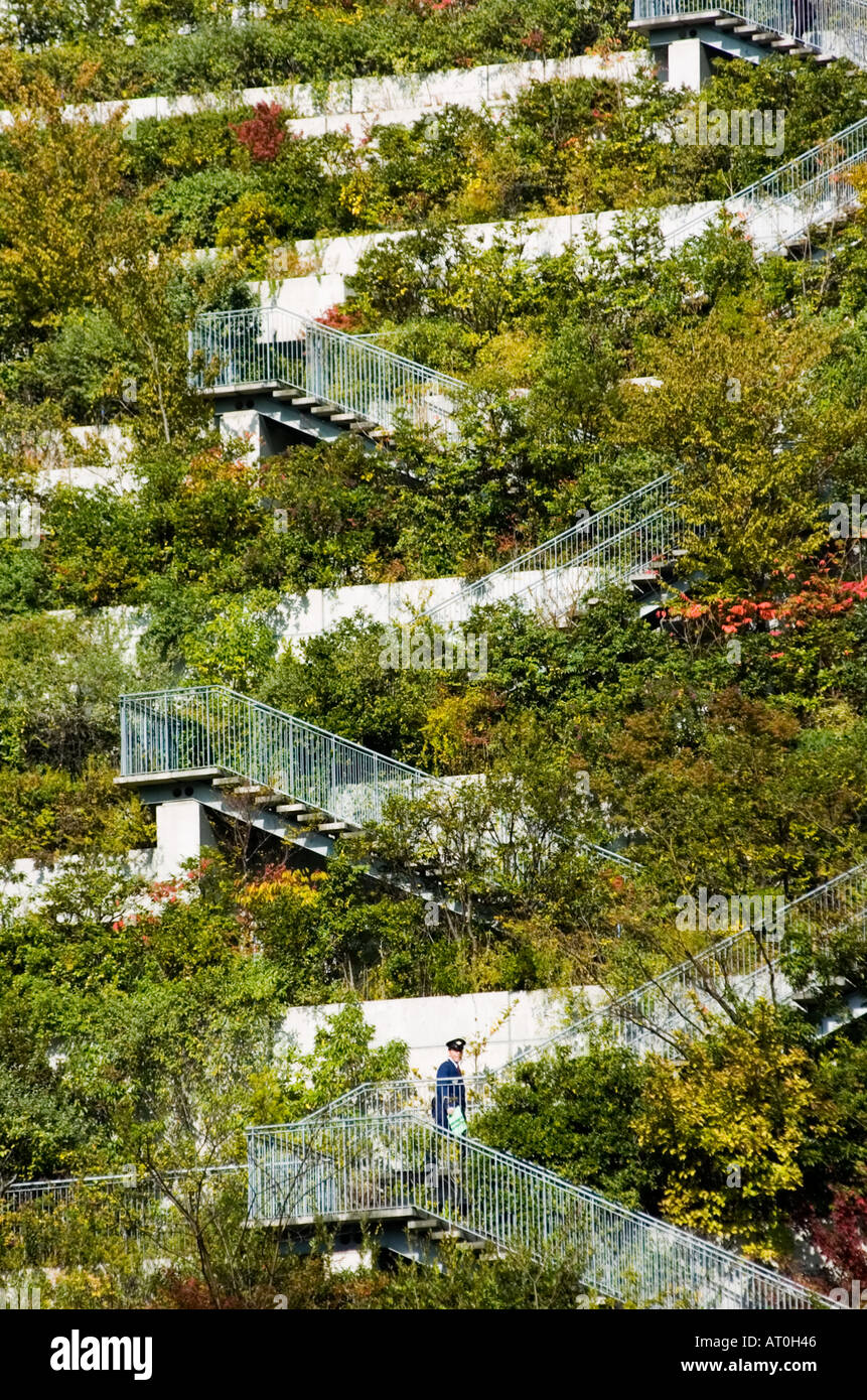 ACROS Fukuoka building has dramatic architecture featuring landscaping down terraced side of building Stock Photo