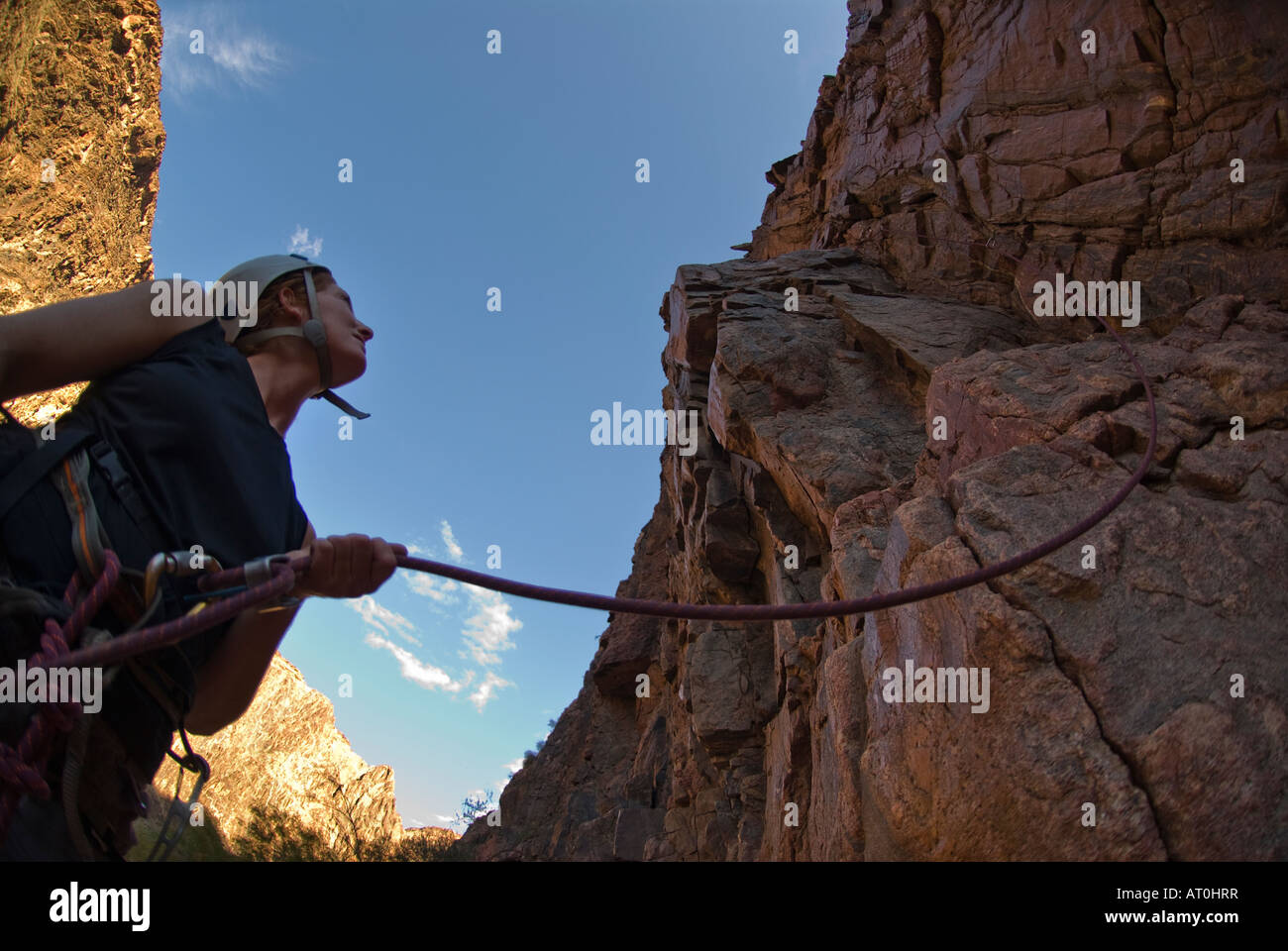 Climbing at Lower Creamation Camp during a raft trip on the Colorado River in the Grand Canyon National Park Arizona Stock Photo
