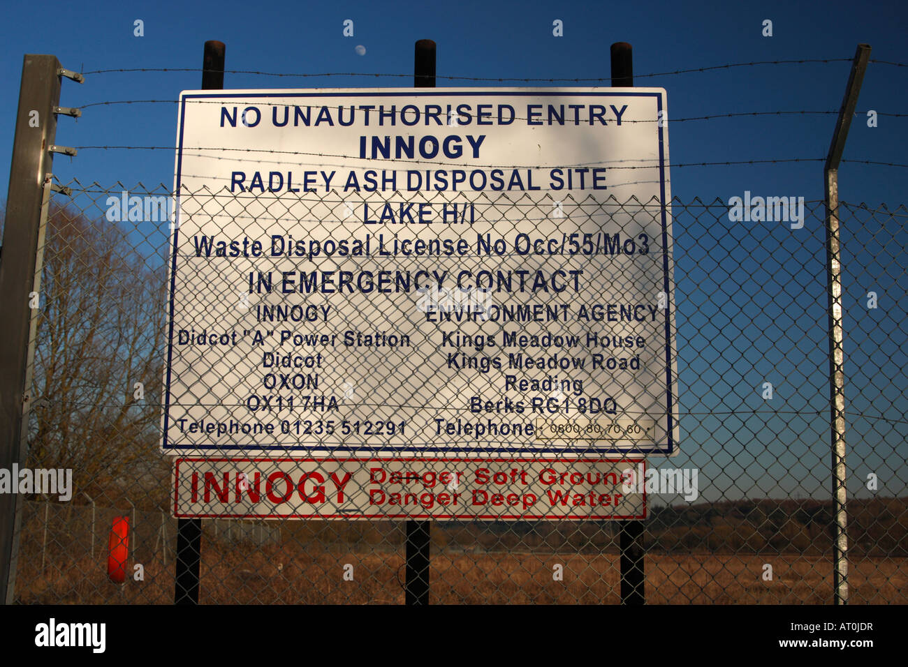 'Radley Lakes' danger sign and security fence, disposal site for waste ash from 'Didcot Power Station', Radley, Oxfordshire, UK Stock Photo