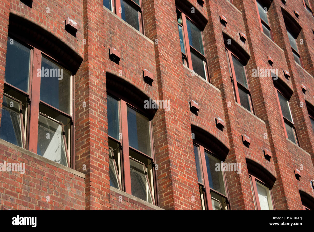 Old red brick city apartment building Stock Photo
