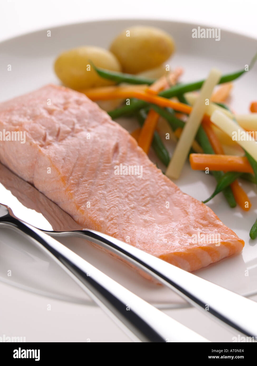 Poached salmon with vegetables Stock Photo Alamy