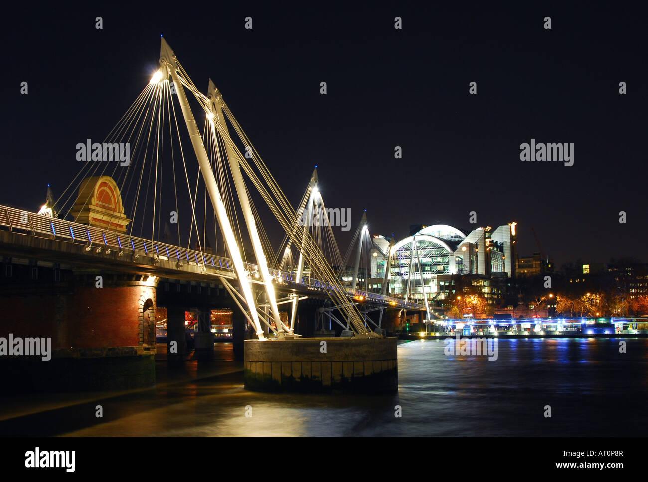 The Golden Jubilee footbridge and Charing Cross station in London Stock Photo