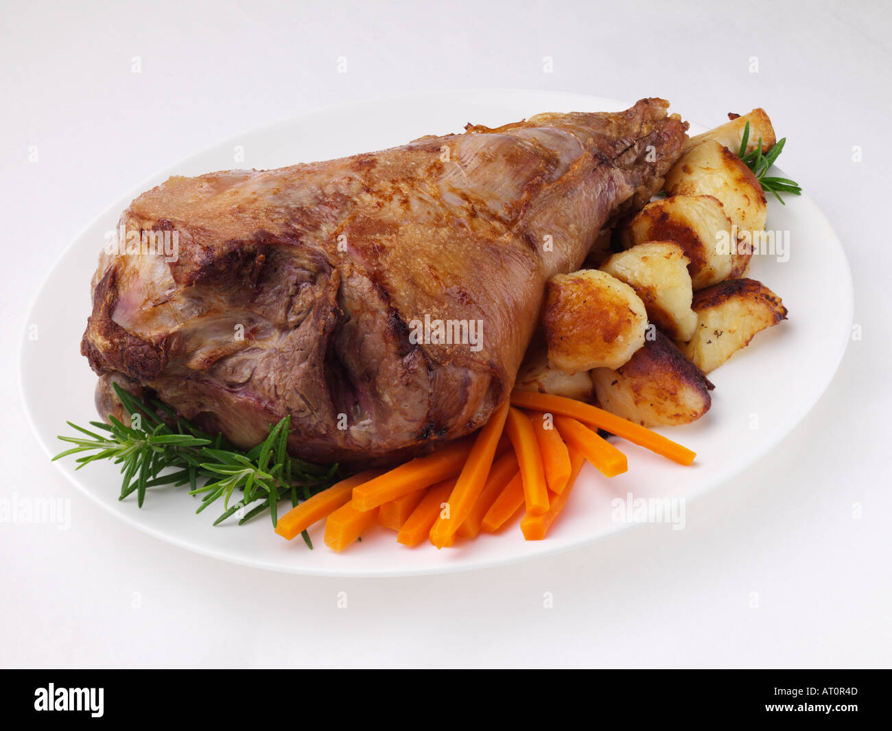 Roast leg of lamb and vegetables Stock Photo Alamy
