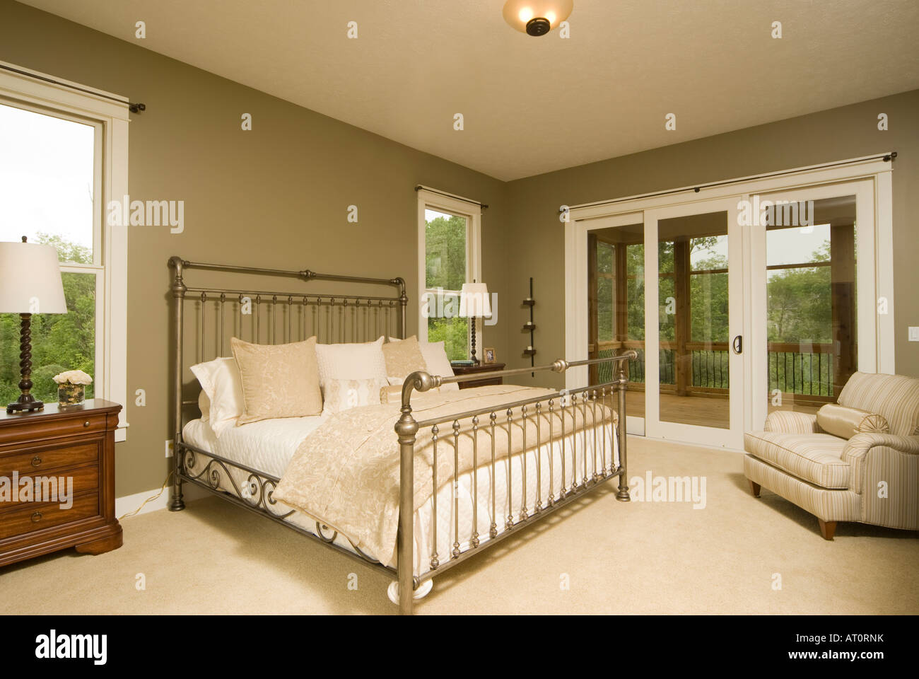 American Master Bedroom With King Size Bed And Sliders To