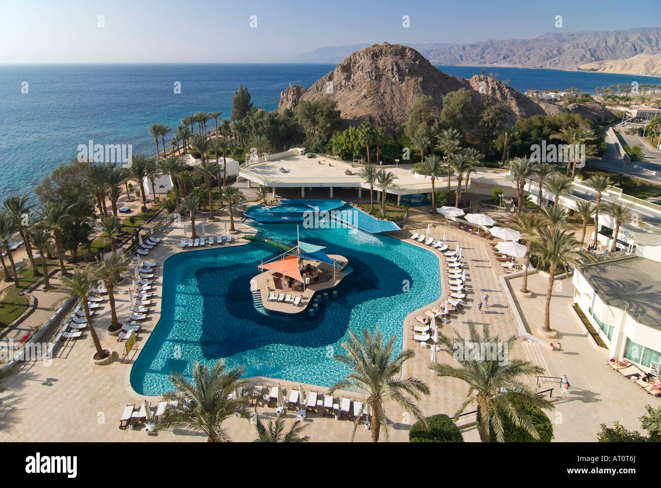 Horizontal aerial wide angle of a hotel swimming pool with a swim up ...