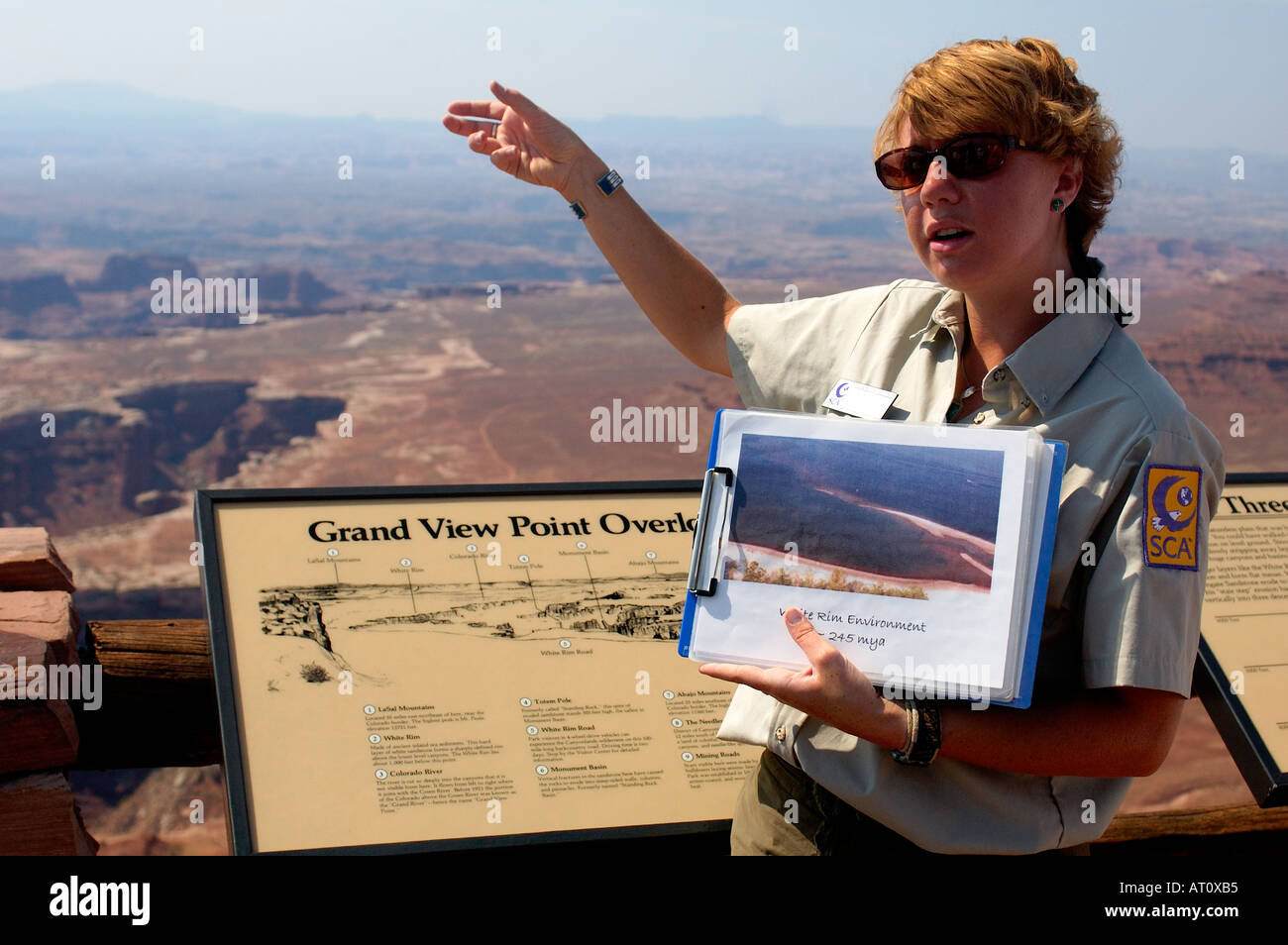 Park ranger discussing the formation of rock layers, Canyonlands ...