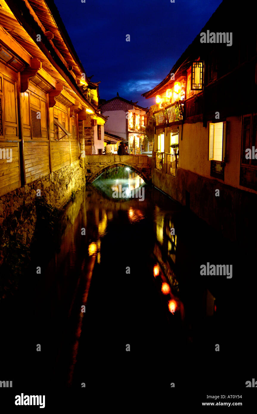 Canal in the old city of Lijiang at dusk, Yunnan Province, China Stock ...
