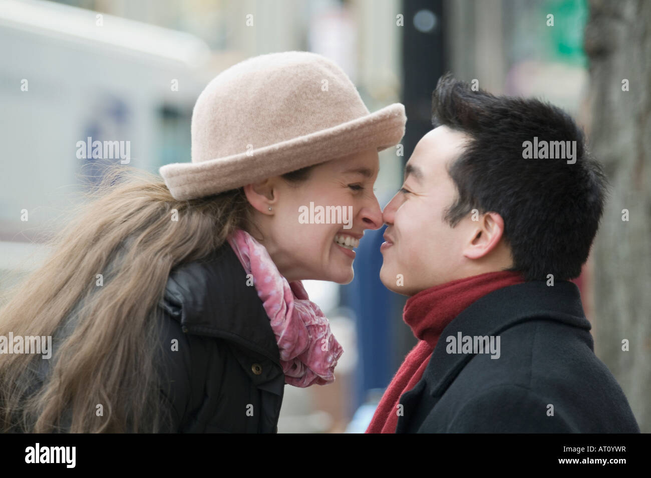 Side profile of a young couple rubbing their noses Stock Photo Alamy