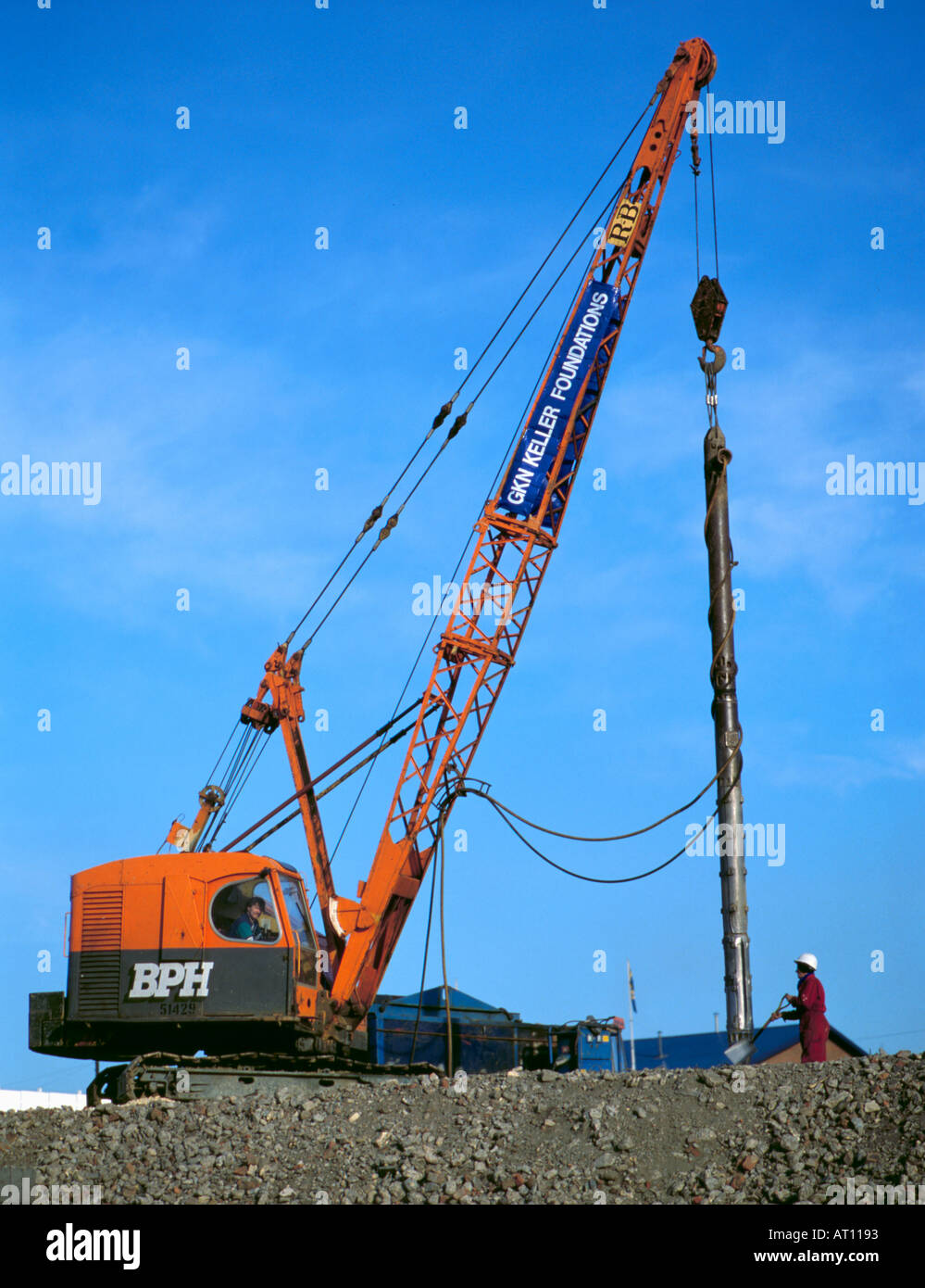 Mobile crane lifting a soil consolidation vibrator Stock Photo Alamy