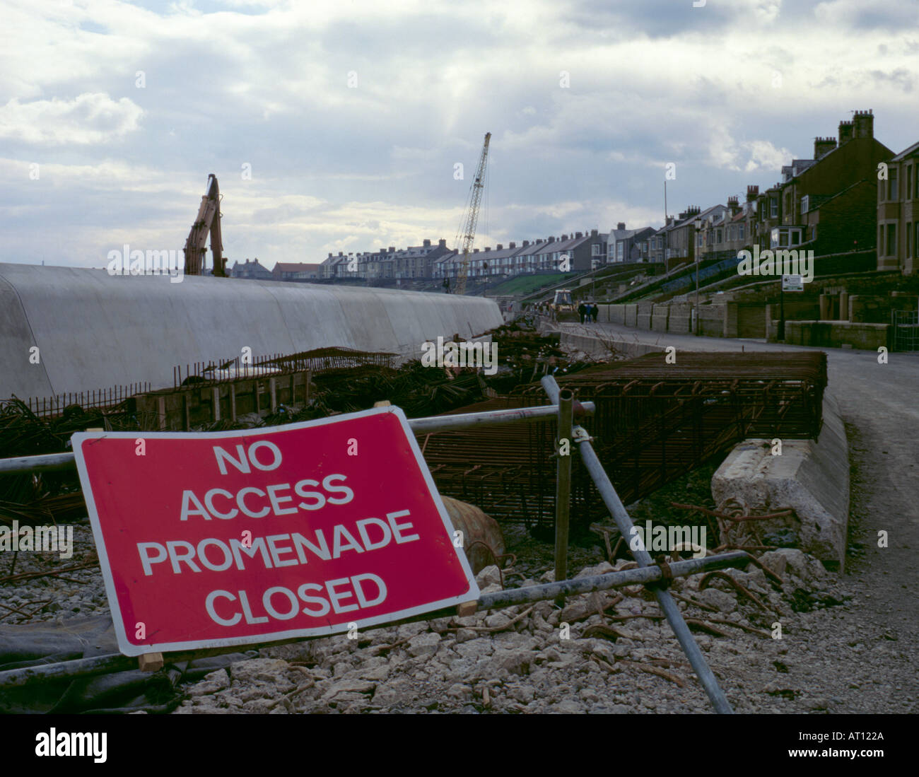 'No Access Promenade Closed' sign, during construction of coastal defence at Newbiggin-by-the-Sea, Northumberland, England, UK. Stock Photo
