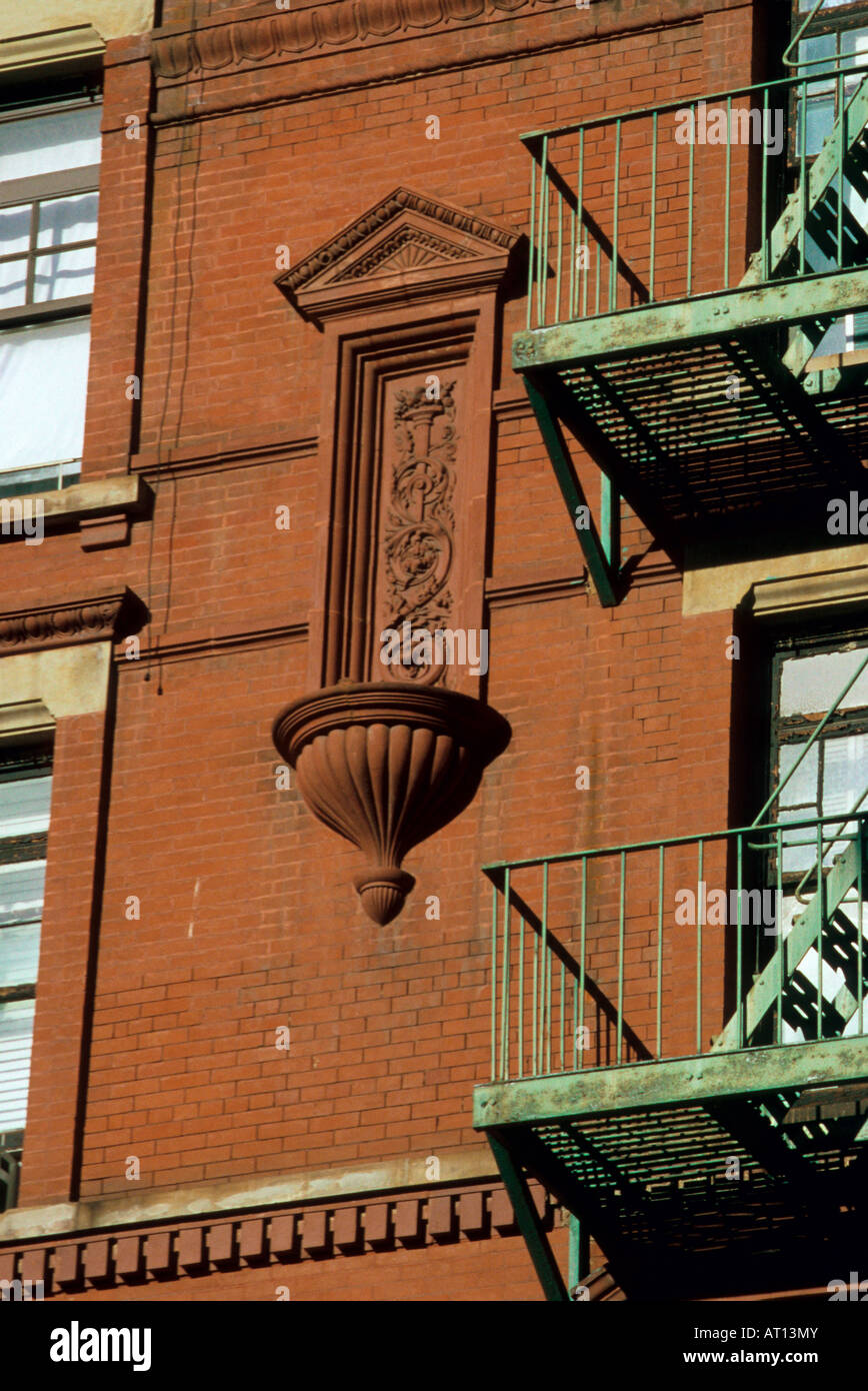 Green Fire Escapes Red Brick building Stock Photo