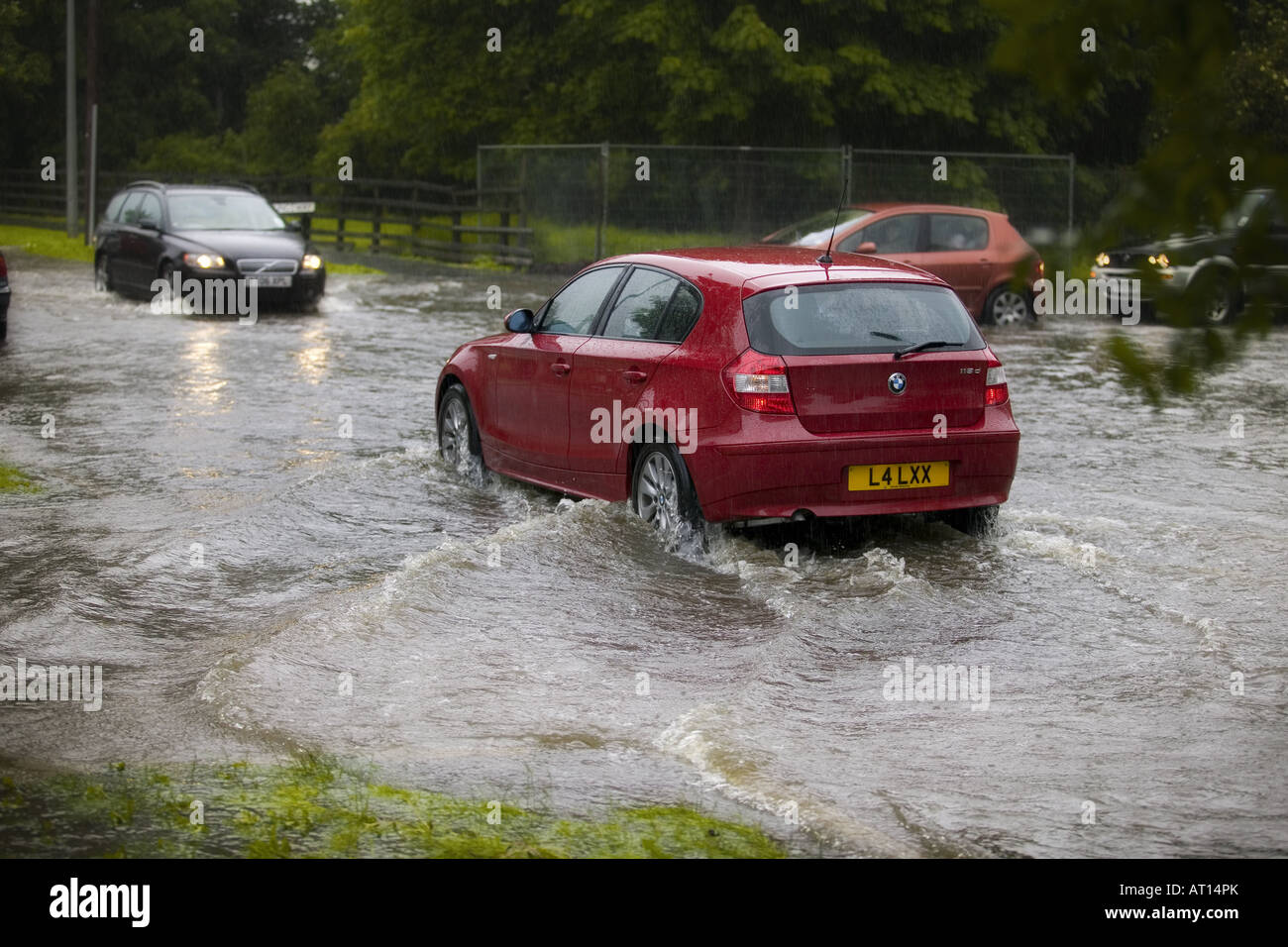 flooding in hull followed a weekend of high temperatures across the UK, cars pushing water from the roads into nearby gardens. Stock Photo