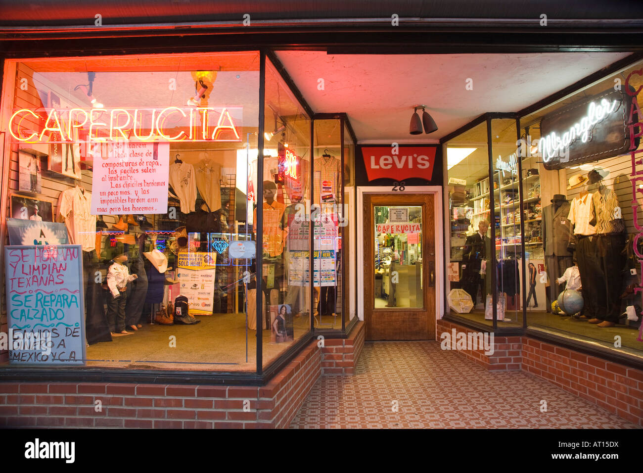 ILLINOIS Aurora Store window at night of clothing store signs in Spanish  neon downtown shopping district Stock Photo - Alamy