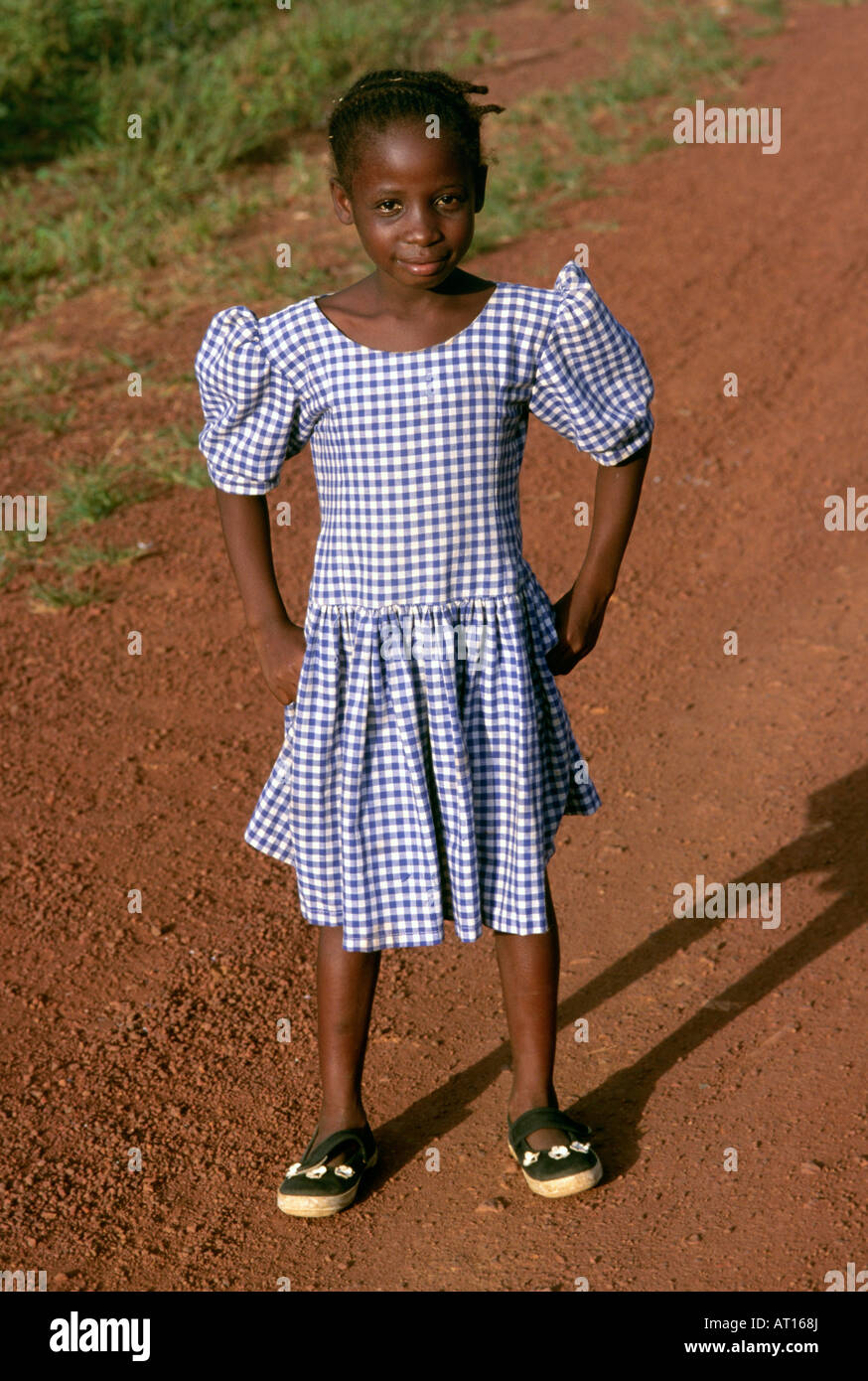 A girl in a school uniform in the town of Tabou, Ivory Coast Stock Photo -  Alamy