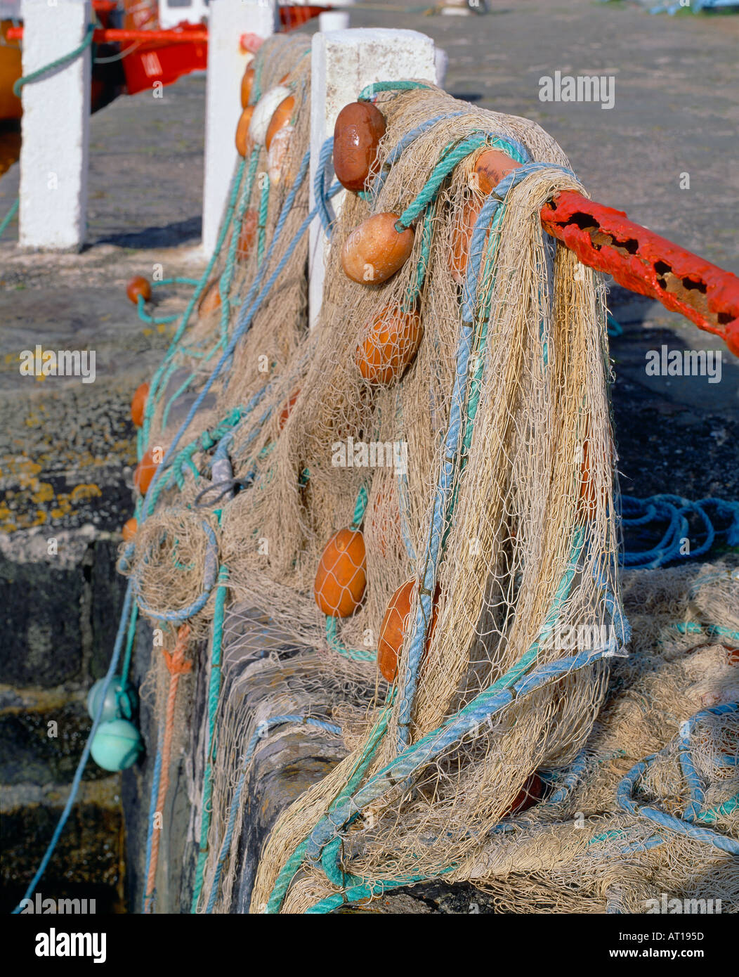 sea fishing nets hanging on rusty metal on an irish pier/quay side