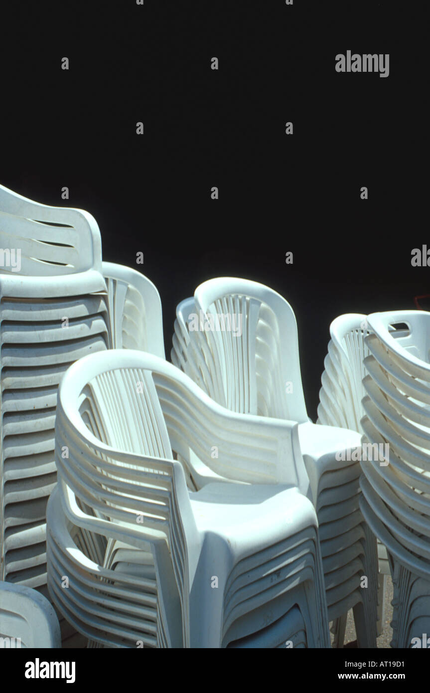 stacked white plastic chairs Stock Photo Alamy