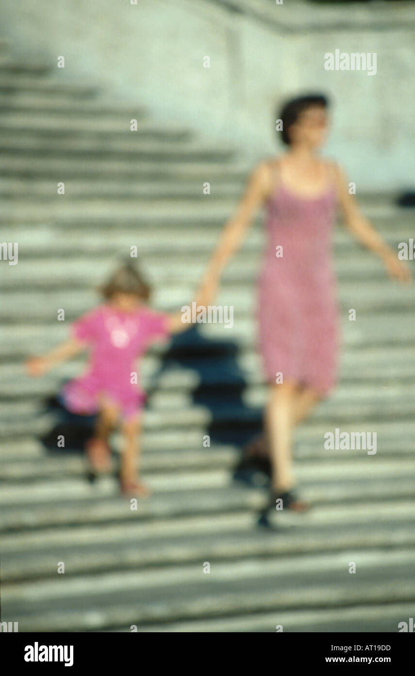 mother and daughter walking down steps Stock Photo Alamy
