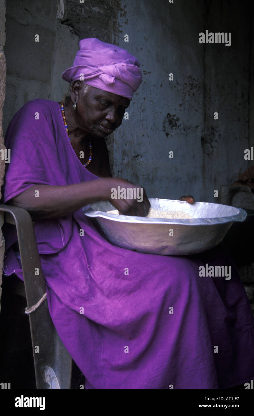 Old lady prepares her rice for cooking Gunjur The Gambia West Africa ...